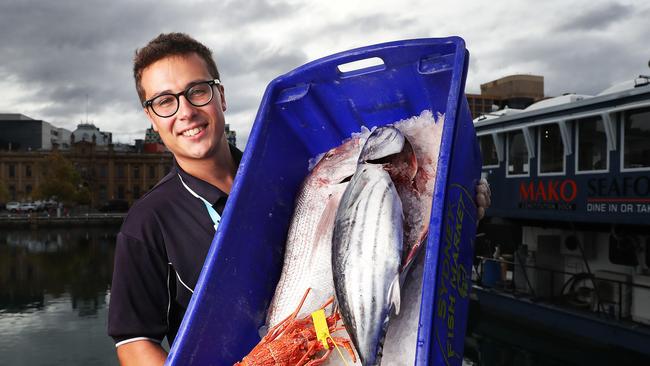 Issac (Issac) Riseley with fish and crayfish from Mako Seafood on the Hobart waterfront ready for Easter. Picture: Nikki Davis-Jones