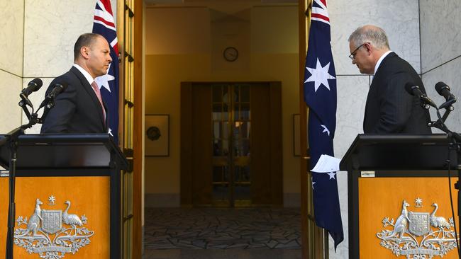 Josh Frydenberg and Scott Morrison leave after speaking to the media on Thursday. Picture: AAP.