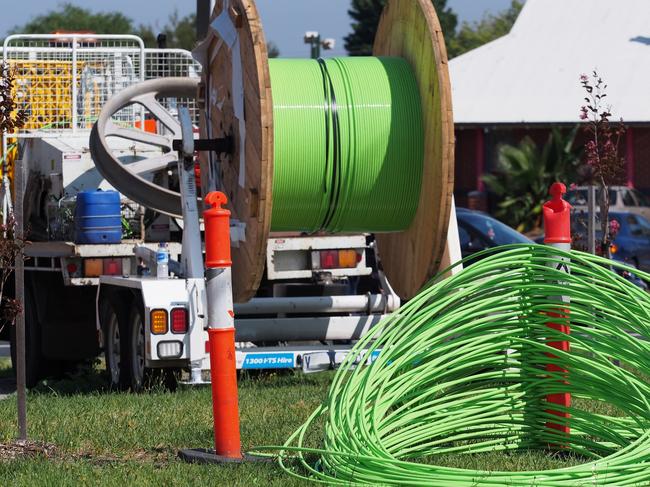 Melbourne, Australia - Green fiber optic NBN cable behind an installation truck, part of the National Broadband Network, supplying homes with high speed broadband.