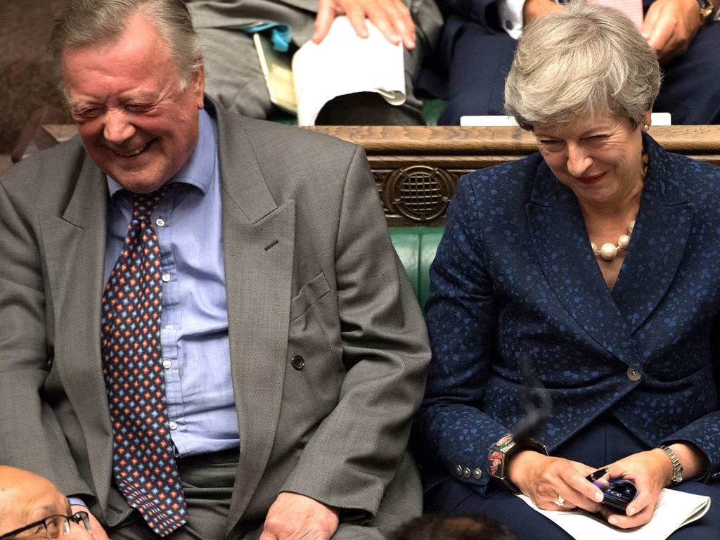 Former British MP Theresa May have a good old chuckle in the House of Commons on Tuesday sitting next to former minister Kenneth Clark, one of the party’s most pro-EU figures. Picture: JESSICA TAYLOR / UK PARLIAMENT / AFP.