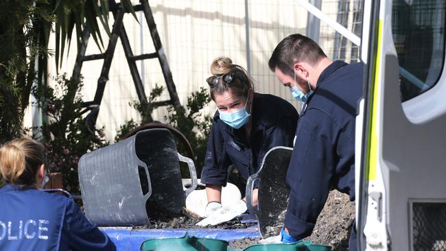 Members of a police strike force investigating following the fire. Picture: Peter Lorimer