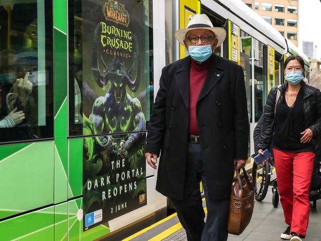 People wearing masks in Melbourne. Picture: Ian Currie