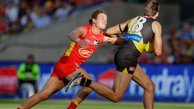 Tom Berry lays a tackle against Richmond. Picture: Russell Freeman/AFL Photos via Getty Images