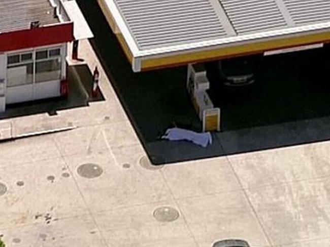 Darren Wallace lays dead at the Picton Shell servo. Picture: Channel 9