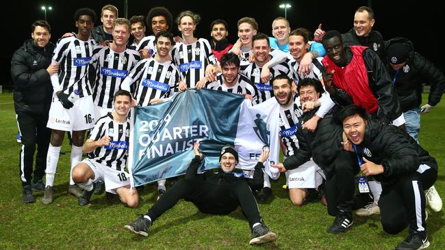 Moreland Zebras players celebrate their Round of 32 win over Magpies Crusaders.