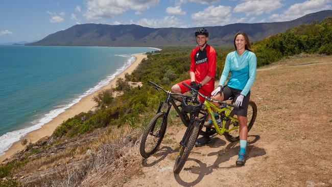 Mountain bikers Brad Jones and Steph Garner at Flagstaff Hill Lookout near Port Douglas yesterday. Picture: Romy Bullerjahn