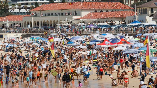 Crowds flocked to Bondi Beach as temperatures climbed on Monday ahead of Tuesday’s scorcher. Picture: Max Mason-Hubers