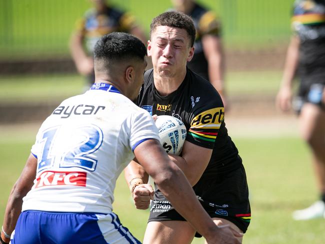 Preston Talamaivao runs into Solomone Tupou. Picture: Julian Andrews