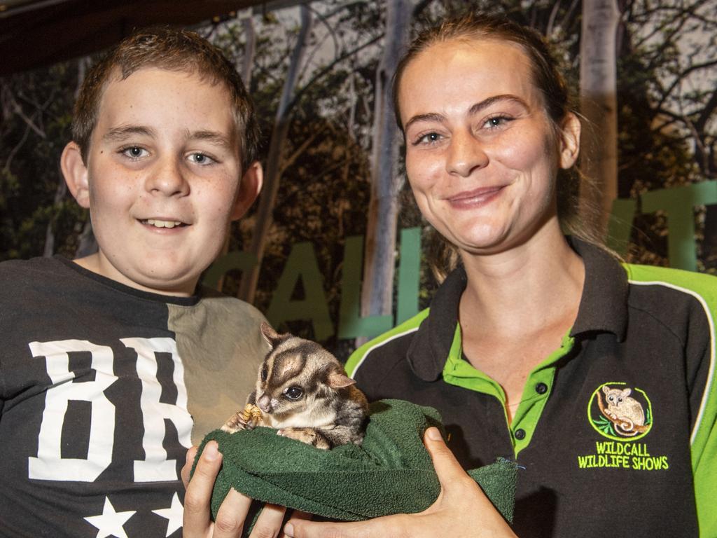 Byron Saville 12yo and wildlife presenter Samantha Whitehead with Max the sugar glider possum. Cobb+Co Museum Easter school holiday program Wildlife Rangers with Wildcall Wildlife Shows. Monday, April 4, 2022. Picture: Nev Madsen.