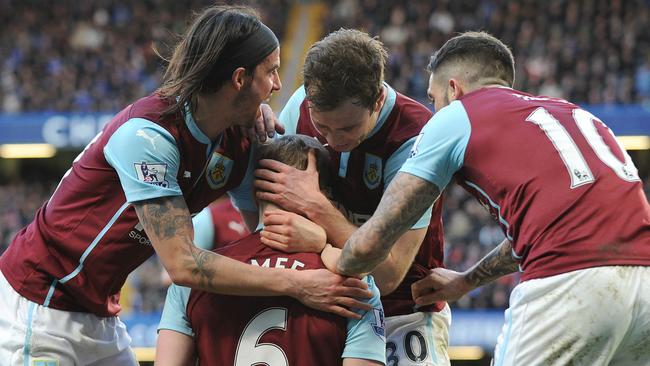 Burnley players celebrate with English defender Ben Mee.