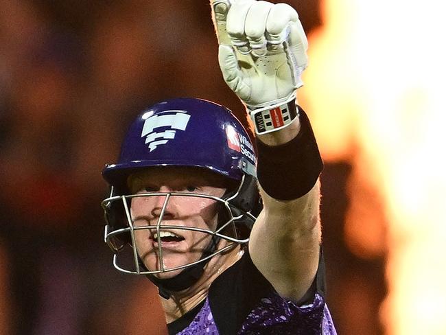 HOBART, AUSTRALIA - JANUARY 27: Mitch Owen of the Hurricanes celebrates scoring a century during the BBL The Final match between Hobart Hurricanes and Sydney Thunder at Ninja Stadium on January 27, 2025 in Hobart, Australia. (Photo by Steve Bell/Getty Images)