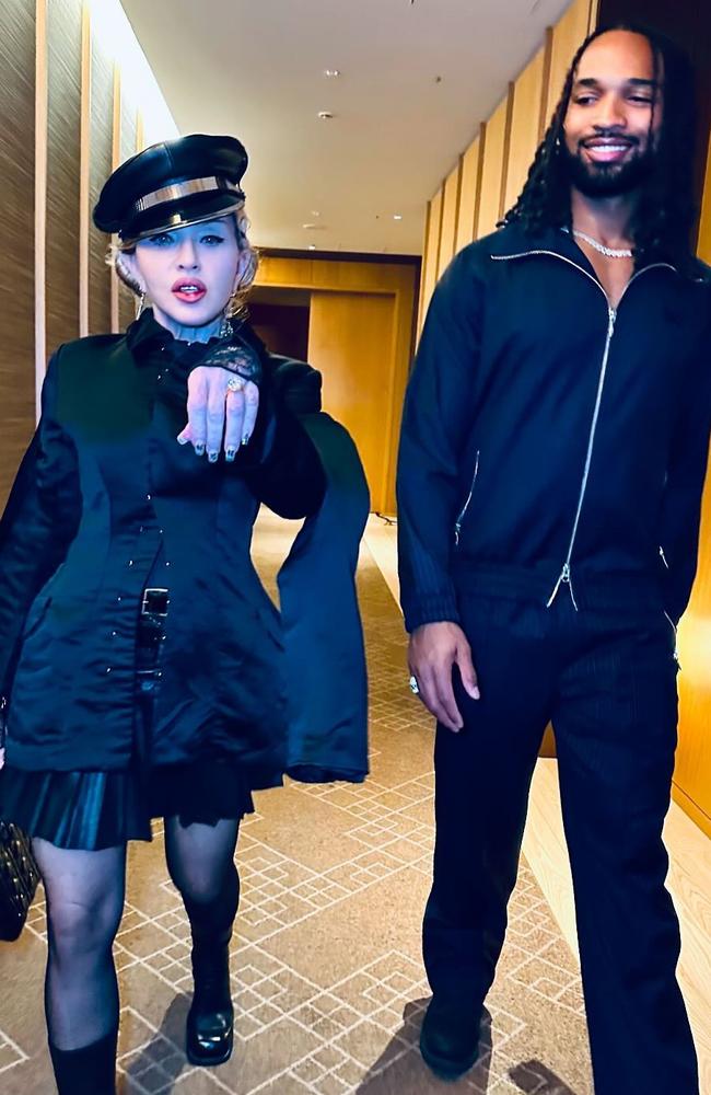 Madonna shows off a diamond ring as boyfriend Akeem Morris looks on. Picture: @madonna/Instagram