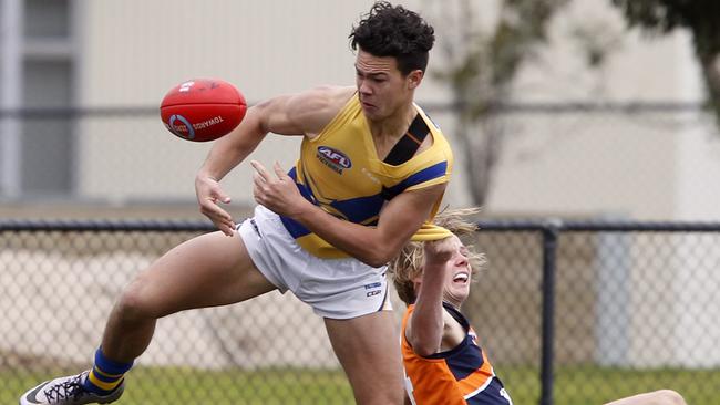 Cameron Rayner escapes from current Geelong defender Zach Guthrie. Picture: Richard Serong