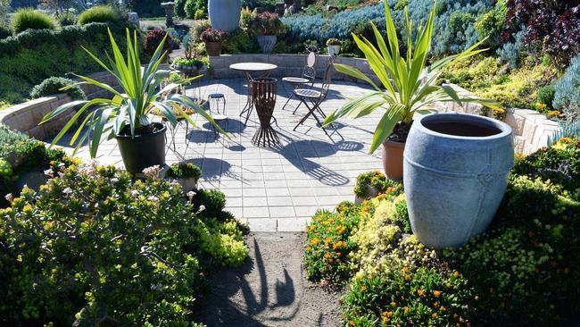 Michele and Attila Kapitany’s garden is a perfect spot to pause and reflect. Picture: Lawrence Pinder