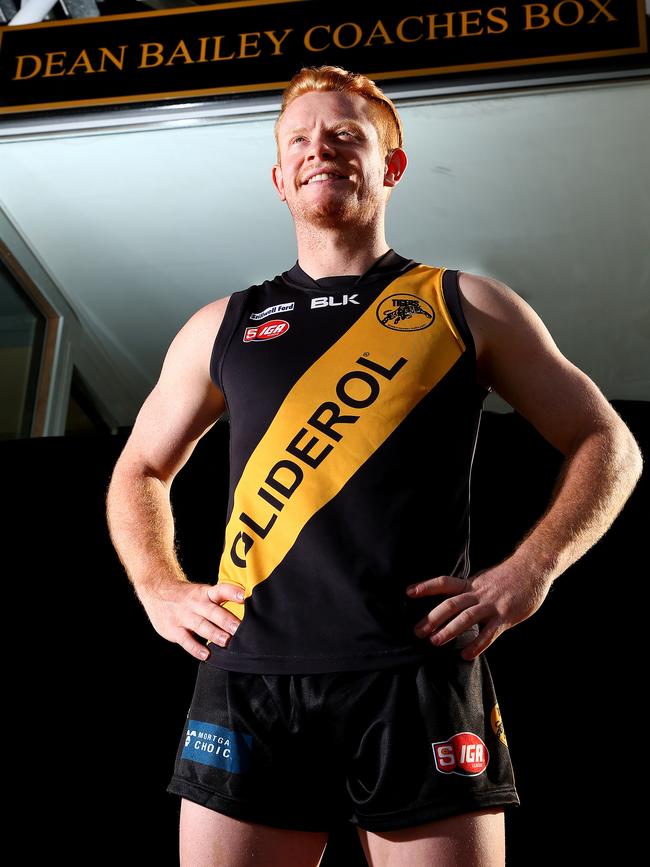 Darcy Bailey in front of The Dean Bailey Coaches Box at Glenelg Oval. Picture: Sarah Reed