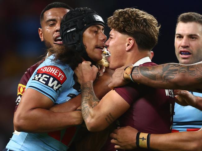 BRISBANE, AUSTRALIA - JUNE 21:  Jarome Luai of the Blues and Reece Walsh of the Maroons scuffle during game two of the State of Origin series between the Queensland Maroons and the New South Wales Blues at Suncorp Stadium on June 21, 2023 in Brisbane, Australia. (Photo by Chris Hyde/Getty Images)