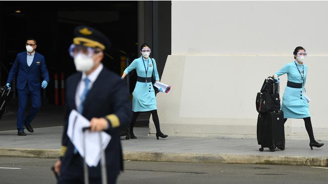 Flight crew seen leaving the terminal after arriving at Sydney International Airport in Sydney.