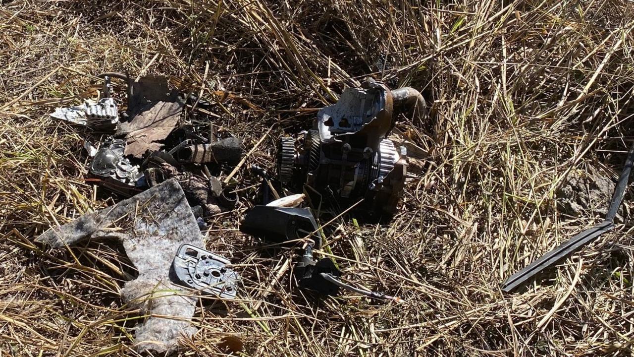 Debris found at the crash site, scattered amongst the mowed down grass.