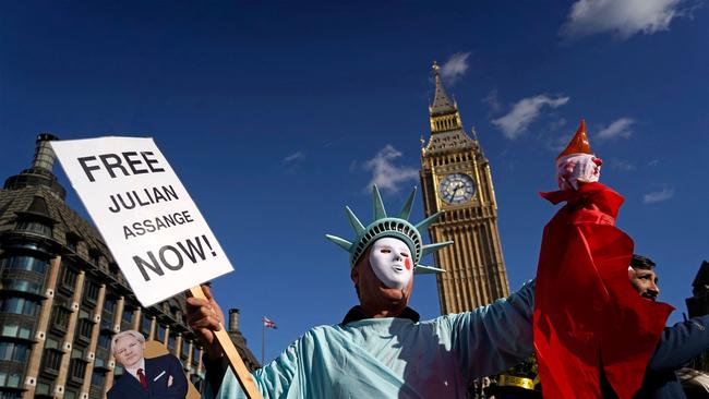 A supporter of WikiLeaks founder Julian Assange holds a placard outside of the Houses of Parliament, in London, on October 8, 2022. Picture: Niklas Halle’n/AFP