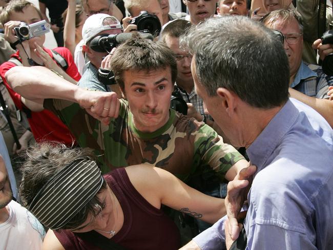 A Russian ultra-nationalist about to punch gay rights campaigner Peter Tatchell 55yrs (C) during a Gay Pride march outside Moscow City Hall, 27 May 2007 : AFP PicMaxim/Marmur - demonstrations o/seas Russia activist headshot violence