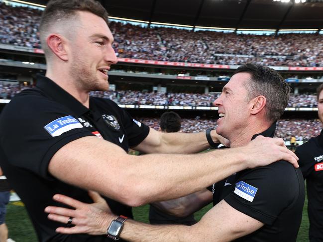 MELBOURNE , AUSTRALIA. September 30, 2023. AFL Grand Final between Collingwood and the Brisbane Lions at the MCG.  Craig Macrae, senior coach of the Magpies with Daniel McStay and Taylor Adams   .Picture by Michael Klein