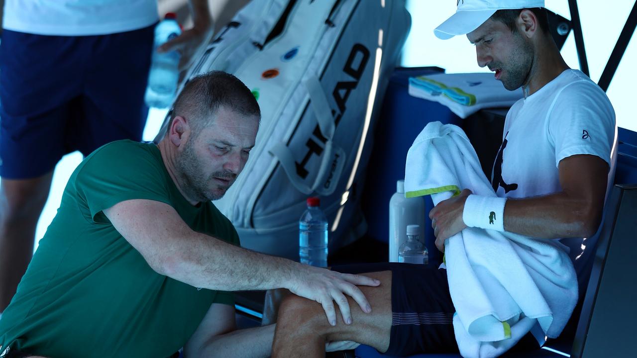 Djokovic receives treatment during the practice match against Daniil Medvedev. Picture: Getty