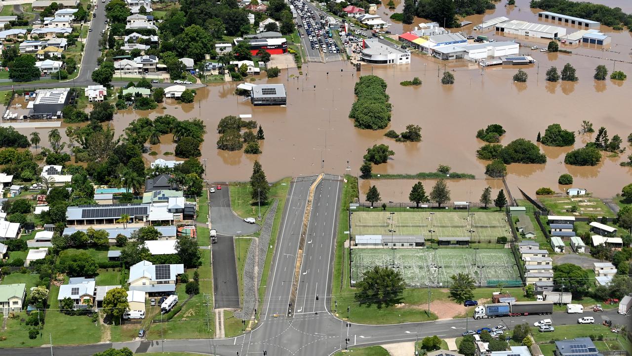 Floodwaters cutoff the highway through Gympie on February 27, 2022. Photo: Bradley Kanaris/Getty Images