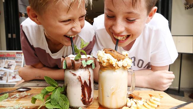 Harry Wheeler and Max Roberts sample Ground Zero's mega milkshakes. Picture: Adam Taylor