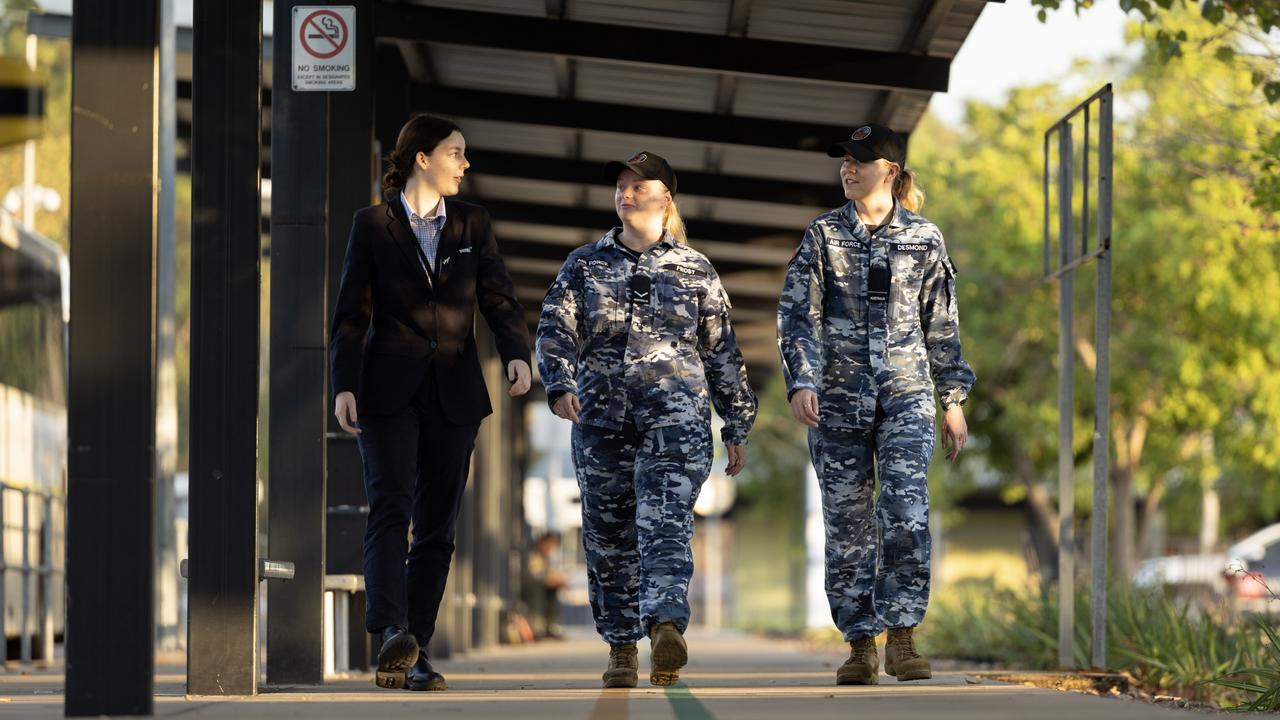 Ventia receptionist Kate Ramage (L) walks with Royal Australian Air Force aviators, Leading Aircraftwoman Beth Frost and Flying Officer Elizabeth Desmond, at the Defence Accommodation Precinct Darwin. Picture: Department of Defence.