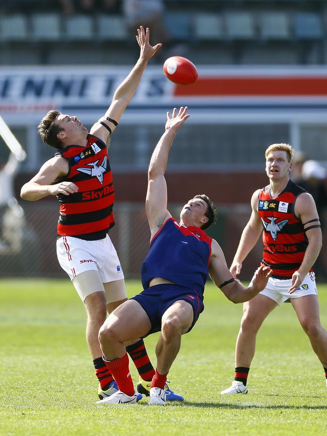 Haydn Smith of Lauderdale and Colin Garland of the Demons go head to head at North Hobart Oval. Picture: MATT THOMPSON