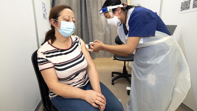 Afaf Kadar receives her second Covid vaccination at the Melbourne Showgrounds. Picture: NCA NewsWire / David Geraghty