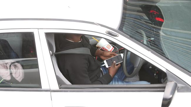 A police crackdown on drivers using phones nabbed 66 people on Tuesday. Picture: Tait Schmaal