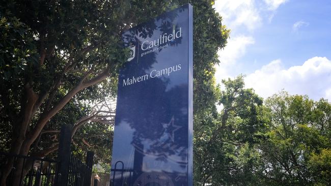 A Caulfield Grammar staff member has been stood down after brothel advertisements on her social media pages were shared by the school community.