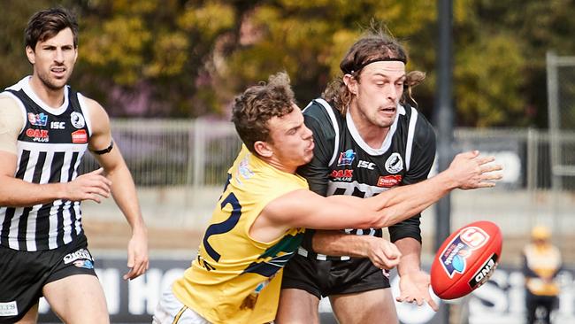 Nicholas Moore tackles Port’s Jarrod Lienert. Picture: MATT LOXTON