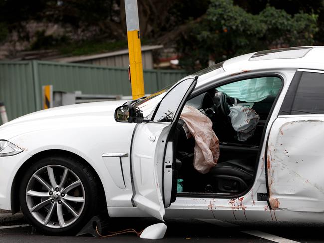 Blood can be seen inside this white car at a crime scene on the Princes Highway in Engadine where there was a car crash and stabbing incident. Picture: NewsWire / Damian Shaw