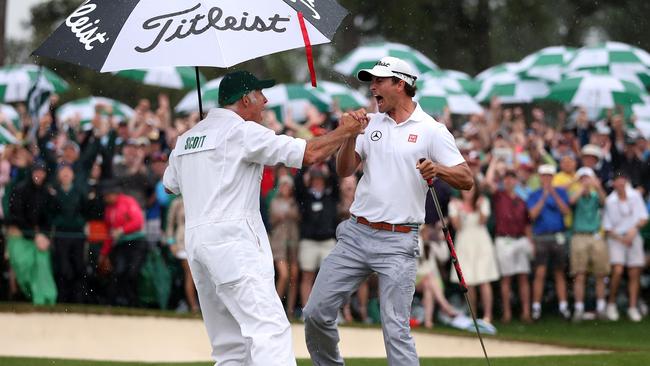 Scott celebrates with caddie Steve Williams at Augusta National. Picture: Andrew Redington/Getty Images