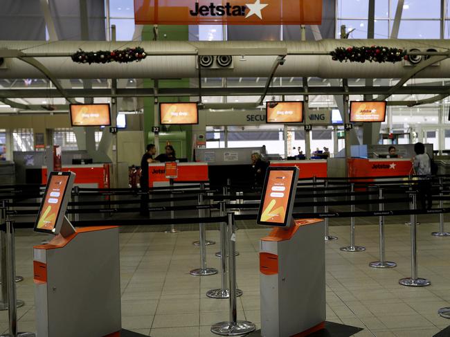 Jetstar self check-in consoles are seen empty at Sydney Airport’s arrivals terminal amid the cancellations. Picture: Getty Images