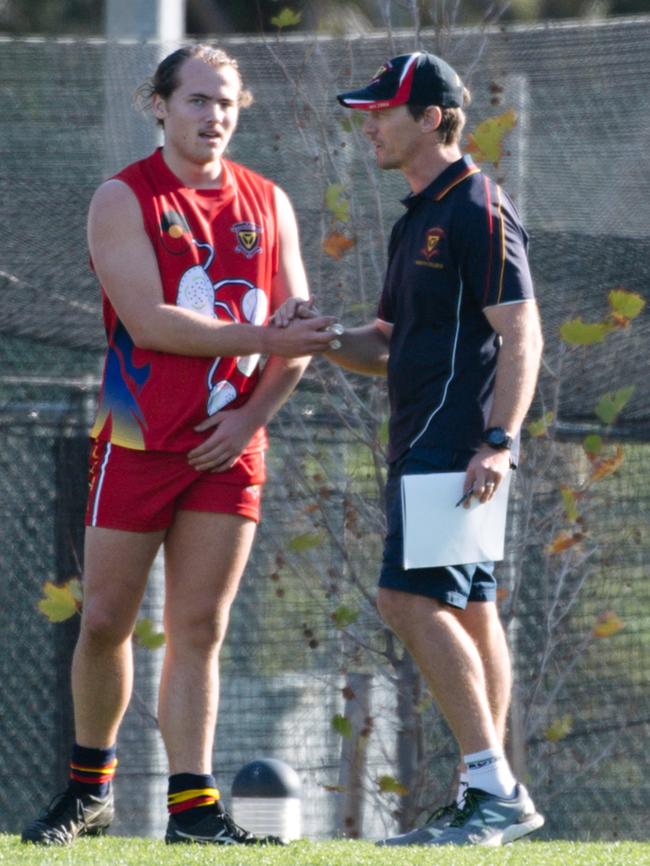 Trinity coach Scott Charlton shaking a player’s hand during the College footy match between Trinity and Immanuel earlier this year. Picture: AAP/Morgan Sette