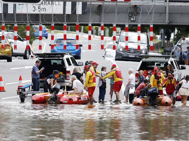 Surf Life Saving volunteers help people at Toowong in inner western Brisbane. Picture: Josh Woning