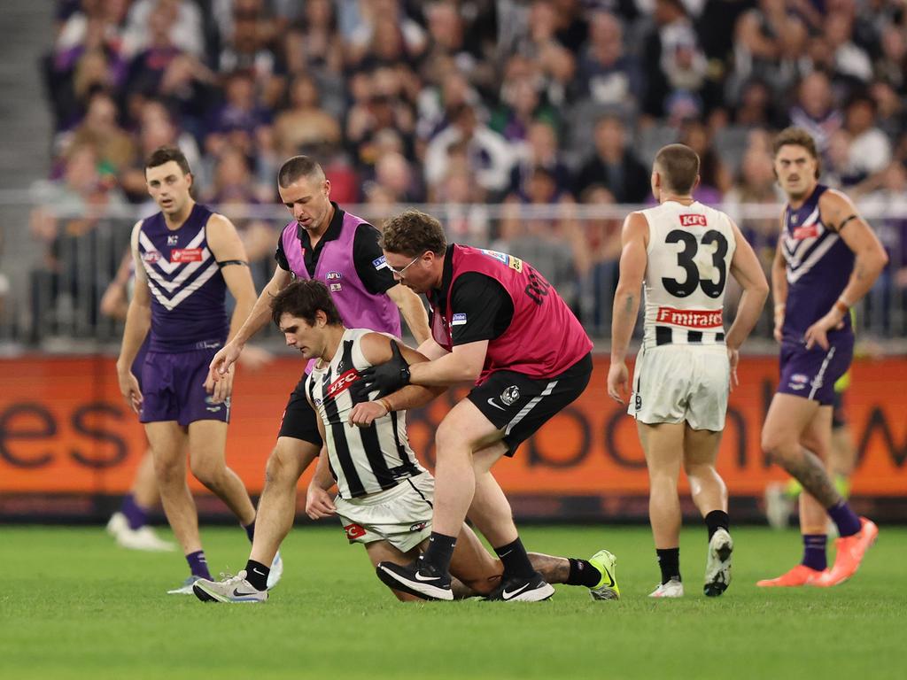 Lachie Schultz after being crunched by Jordan Clark. Picture: Janelle St Pierre/AFL Photos via Getty Images.
