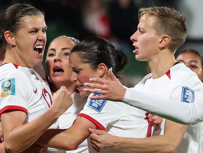 Canada's forward #19 Adriana Leon (2nd L) celebrates with her teammates after scoring her team's second goal during the Australia and New Zealand 2023 Women's World Cup Group B football match between Canada and Ireland at Perth Rectangular Stadium in Perth on July 26, 2023. (Photo by Colin MURTY / AFP)