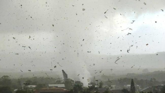The waterspout sweeps through the town of Lennox Head. Picture: Ross Tuckerman