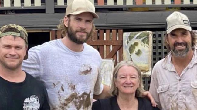 Luke and Liam Hemsworth, brothers of Thor star Chris, were joined by tennis legend Pat Rafter and others cleaning up in Lismore during historic floods.