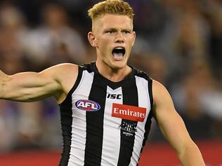 Adam Treloar of the Magpies reacts after kicking a goal during the Round 1 AFL match between the Collingwood Magpies and Western Bulldogs at the MCG in Melbourne, Friday, March 24, 2017. (AAP Image/Julian Smith) NO ARCHIVING, EDITORIAL USE ONLY