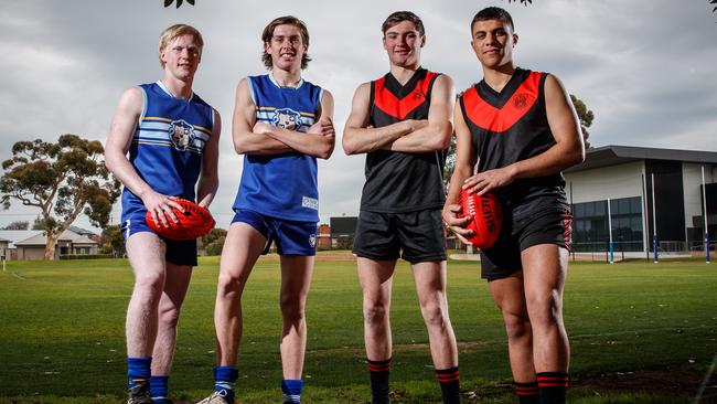 Sacred Heart captain Beau McRae and teammate Will Day with Rostrevor’s Cameron Taheny and his skipper Stefan Lanzoni ahead of Saturday’s First XVIII football intercol at Sacred Heart College. Picture: Matt Turner