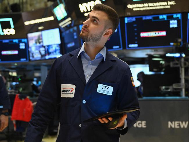 A trader works on the floor of the New York Stock Exchange (NYSE) during morning trading on March 4, 2024 in New York City. Wall Street stocks dipped in early trading Monday at the start of a heavy week of economic news that includes congressional testimony from Federal Reserve Chair Jerome Powell. (Photo by ANGELA WEISS / AFP)