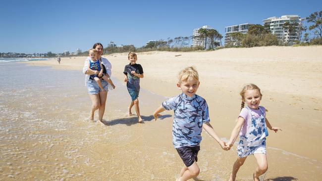 Steph Hartas with her children Noah, 6, Theo, 2, Azaliya, 4 and Aidan, 8, at Maroochydore beach. Picture: Lachie Millard