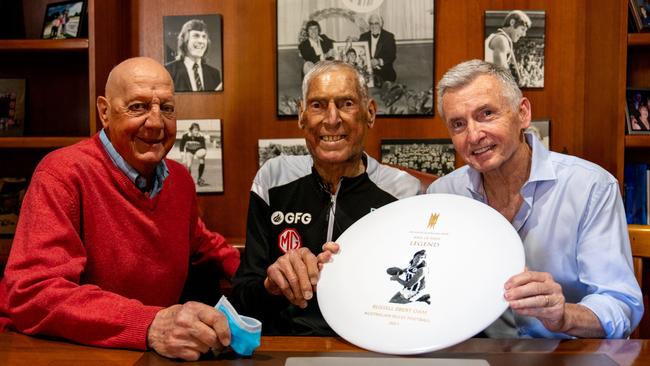 Russell Ebert is presented with his South Australian Sport Hall of Fame Legend status by Barrie Robran and Bruce McAvaney. Picture Jordan Bianchini from PAFC