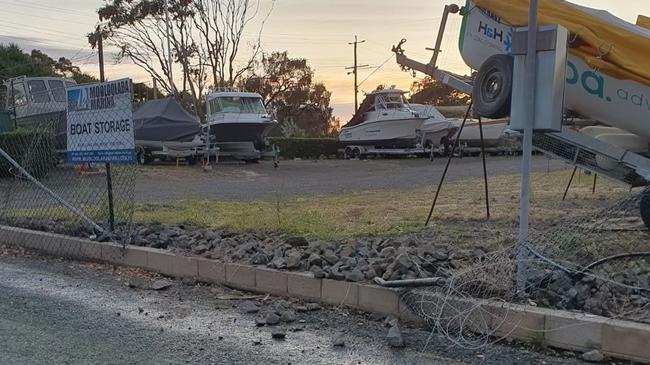 Thieves cut a massive hole in the fence to take a boat, worth more than $100,000 at the Mooloolaba Marina.