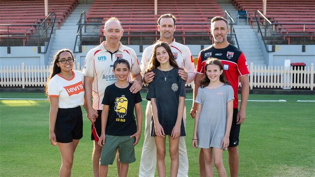 Veteran first grade cricketers James, Rob and Glenn Aitken with their children. Photo: North Sydney Cricket